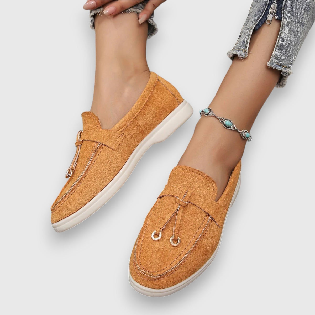 Womens slip-on loafers shown in soft neutral and pastel colour options