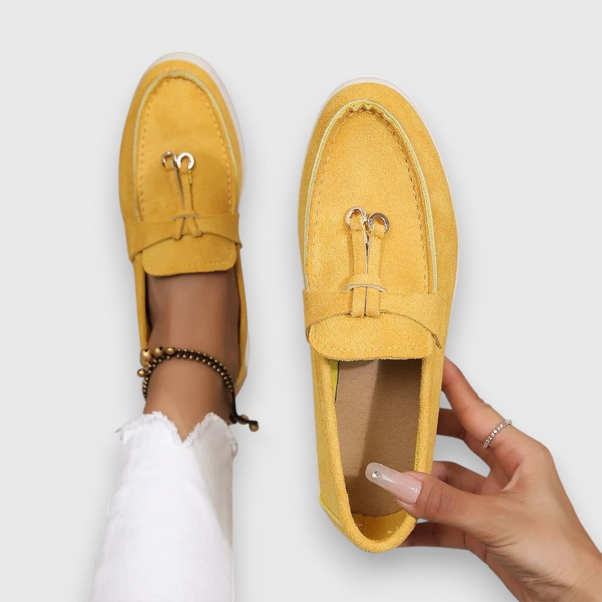 Womens slip-on loafers shown in soft neutral and pastel colour options