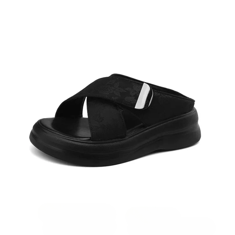 Floral textured platform sandals with wide crisscross velcro straps and elevated sole