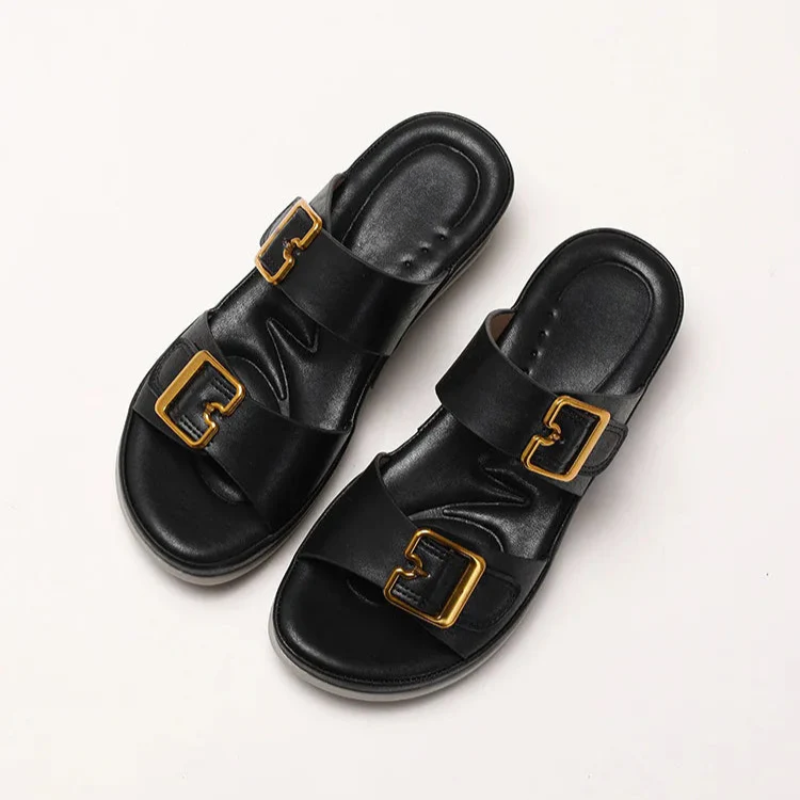 Women's cushioned double-strap slide slippers with gold-tone buckles in a neutral tone